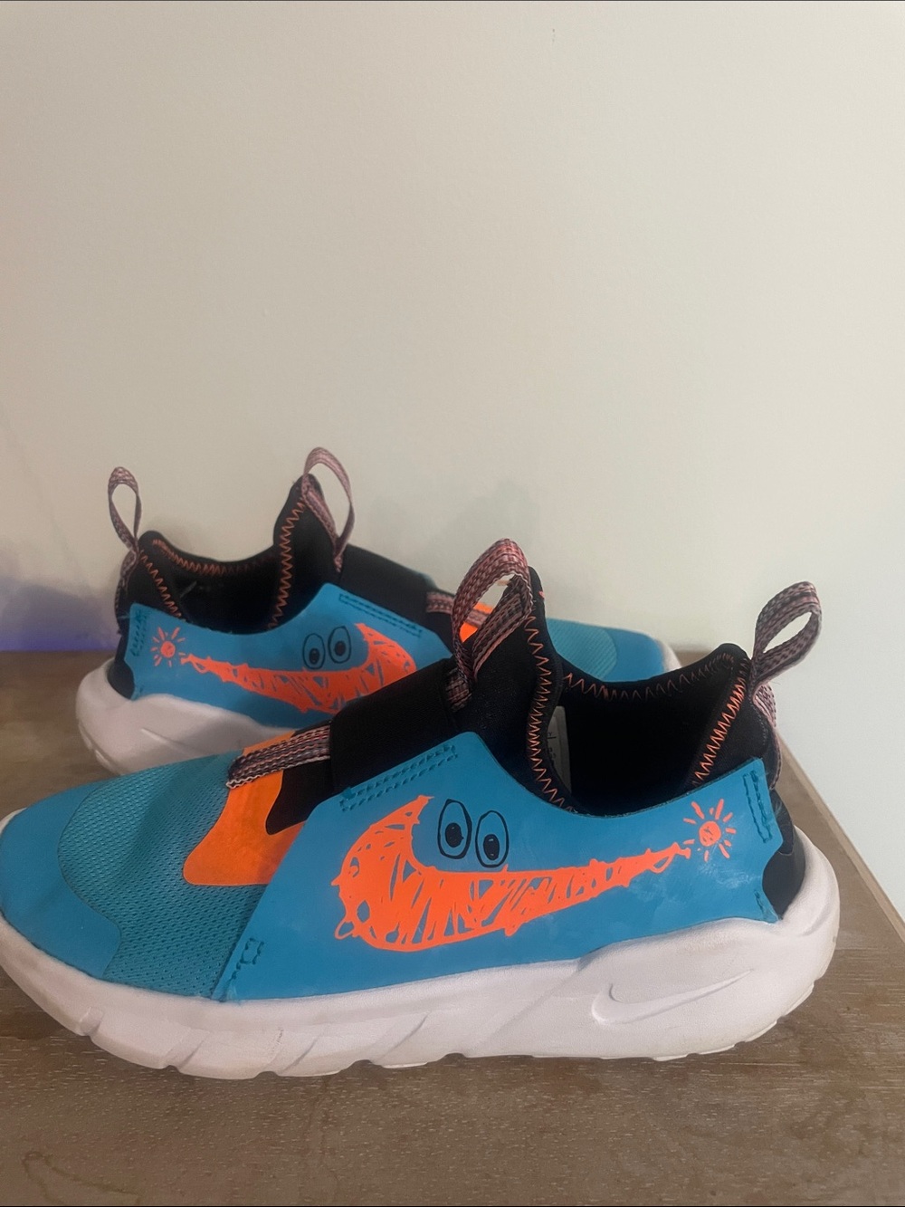 Nike Kids Slip-On Sneakers in Turquoise with Orange Accents